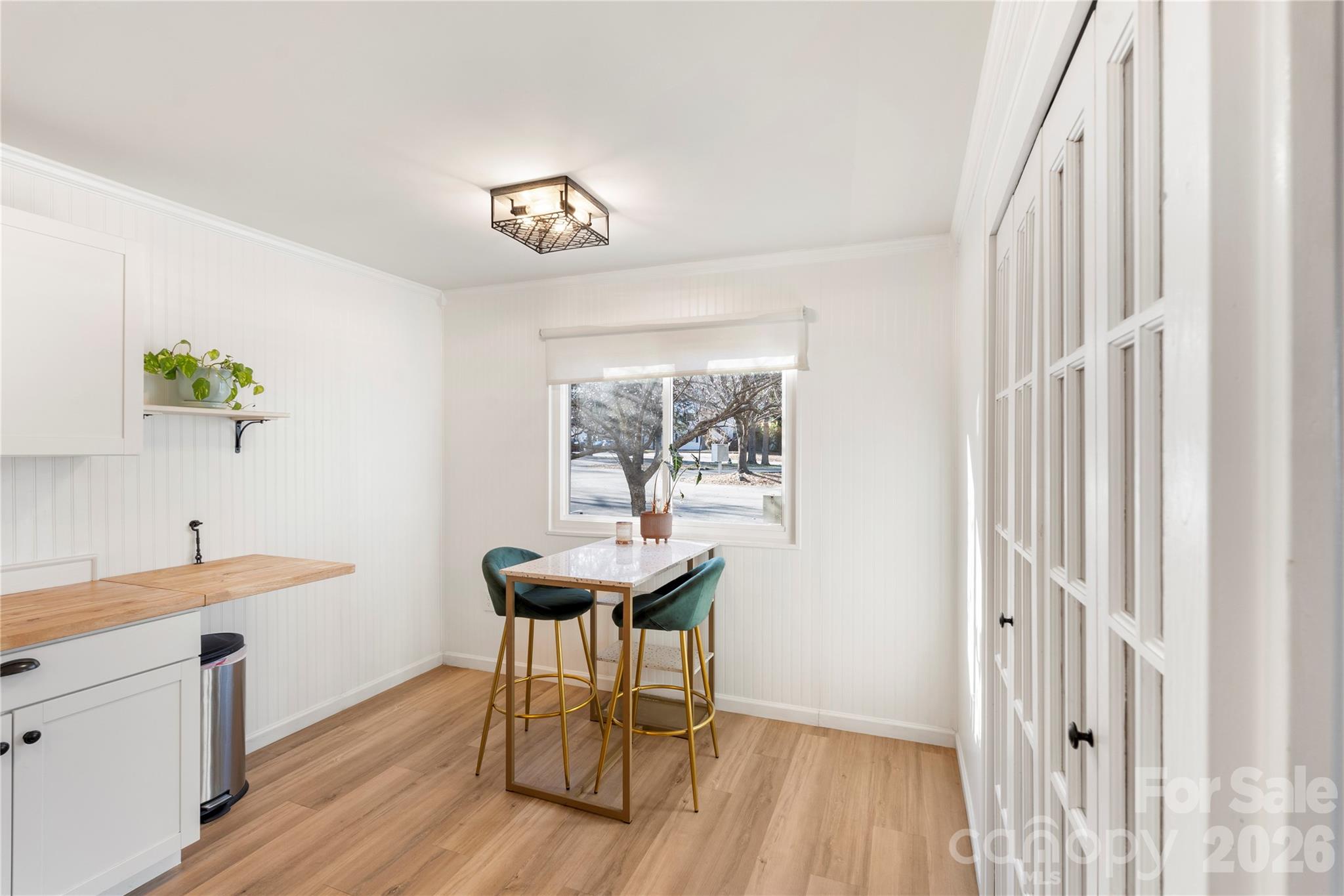1646 Hunters Trail Rock Hill, SC 29732 - Photo 11 of 36 a dining room with wooden floor and a hallway