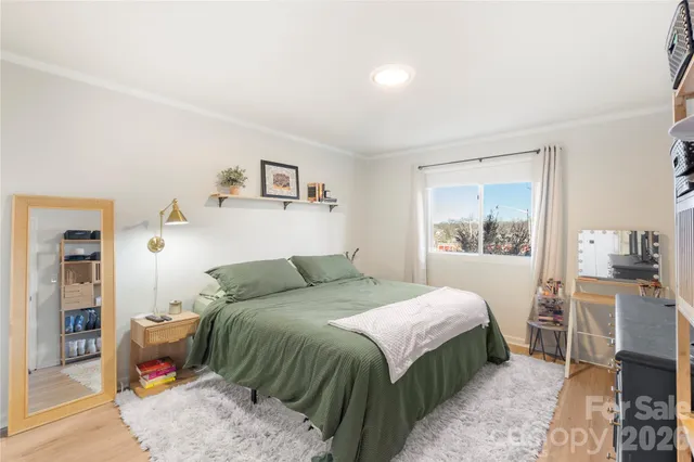 a bedroom with a bed and a table in it