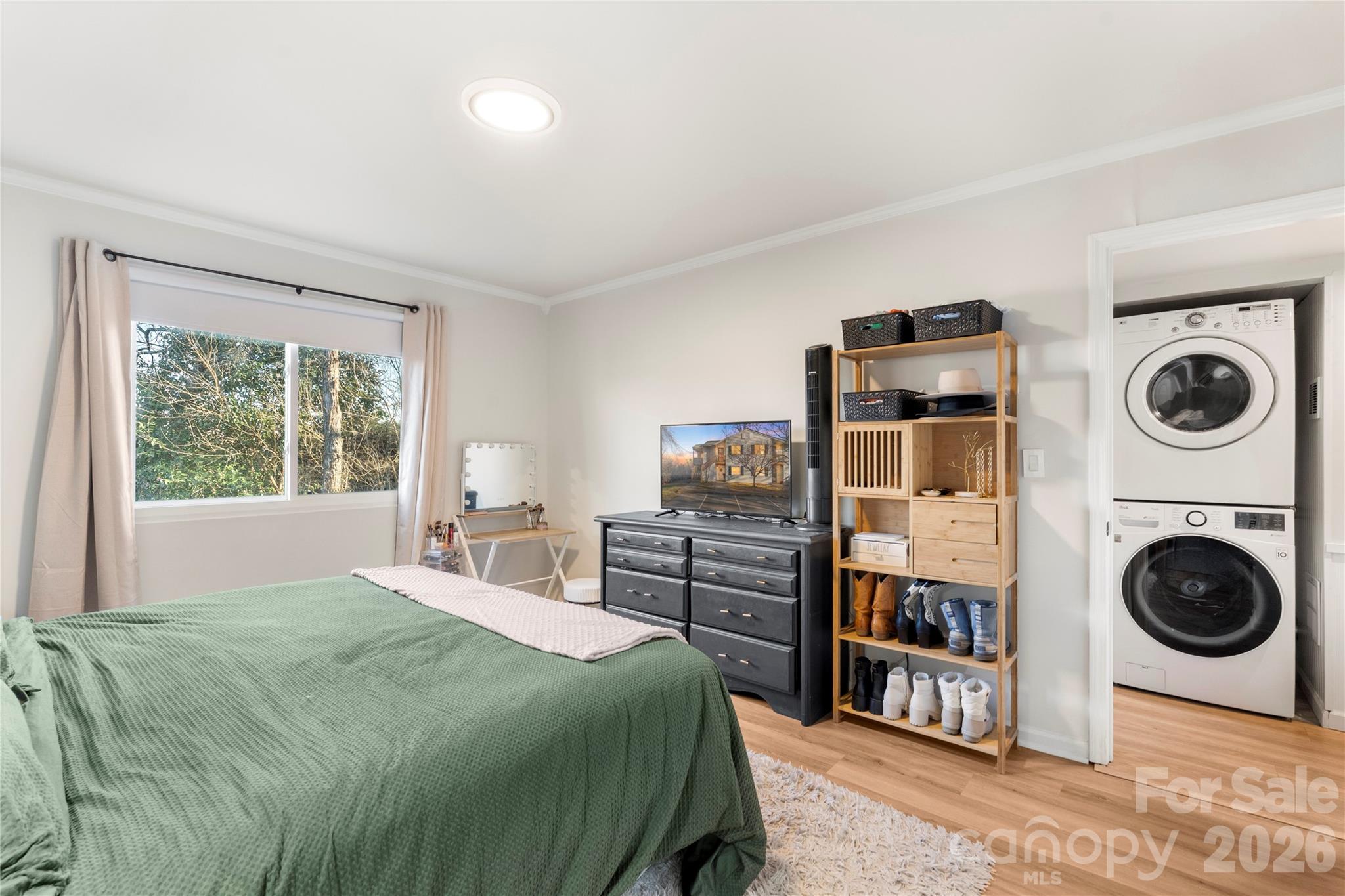 1646 Hunters Trail Rock Hill, SC 29732 - Photo 15 of 36 a bedroom with a bed and a washing machine in it