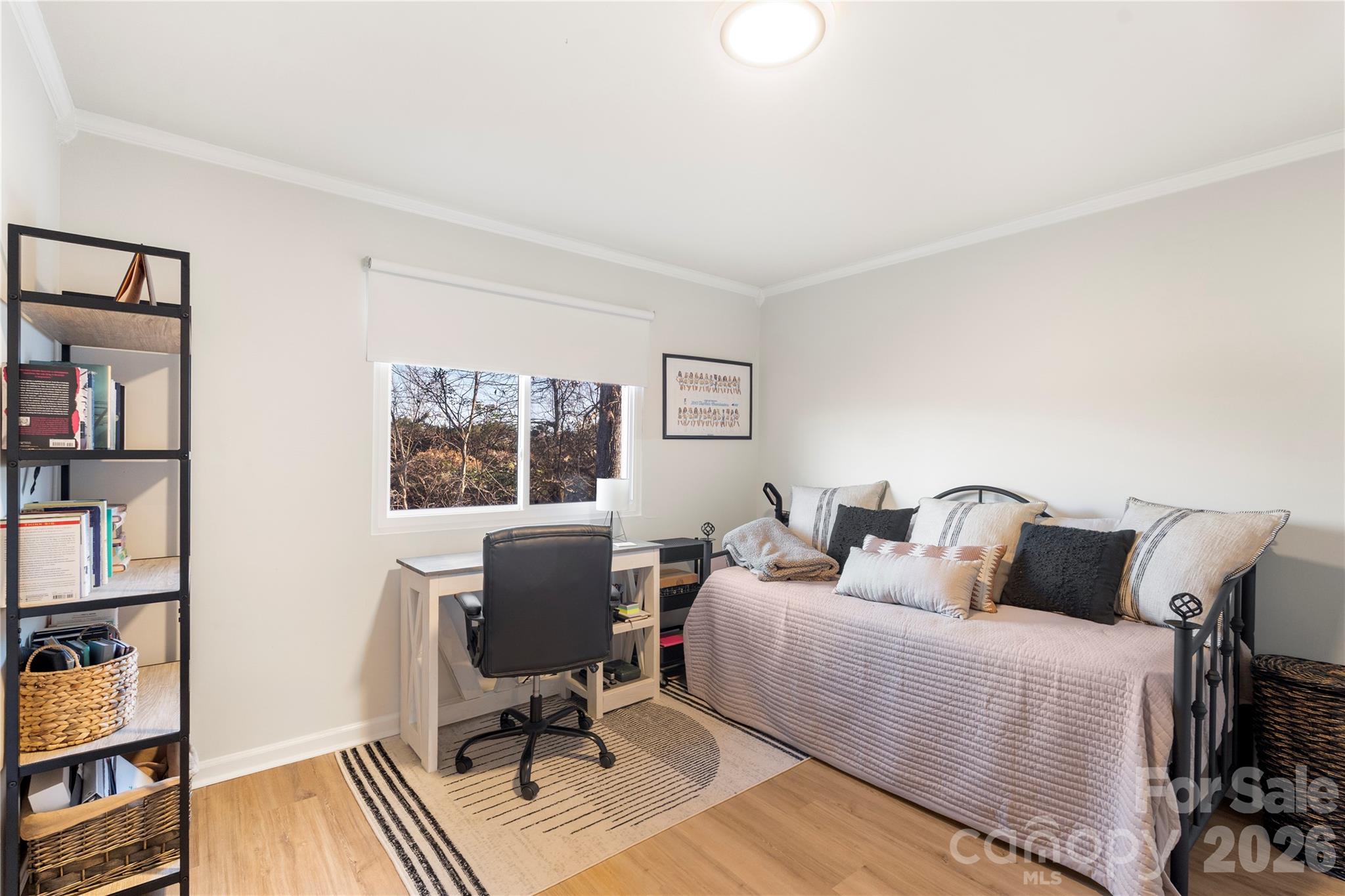 1646 Hunters Trail Rock Hill, SC 29732 - Photo 17 of 36 a bedroom with a bed a book shelf and a window
