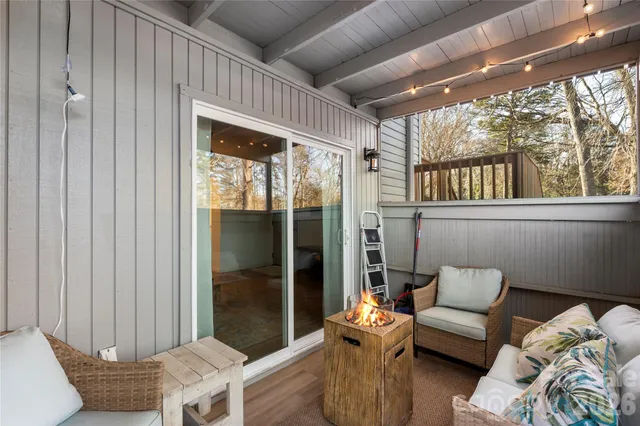 a view of a house with brick walls