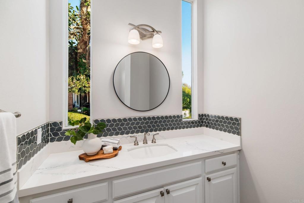 2515 Luciernaga Street Carlsbad, CA 92009 - Photo 18 of 58 a bathroom with a sink and a mirror