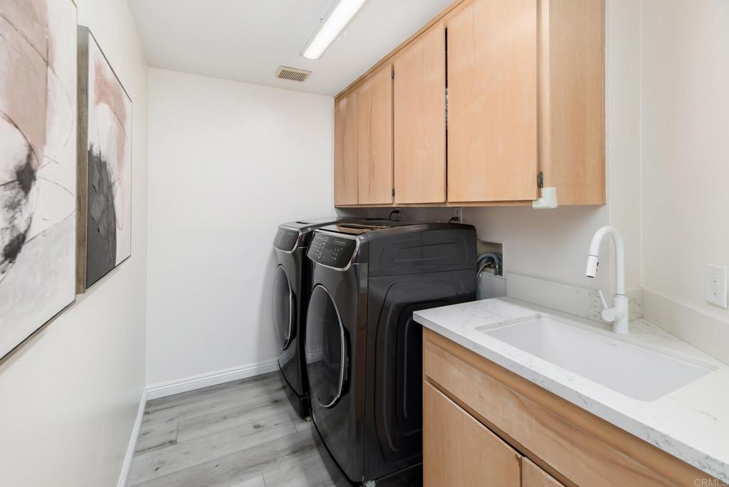 2515 Luciernaga Street Carlsbad, CA 92009 - Photo 19 of 58 a utility room with dryer and washer