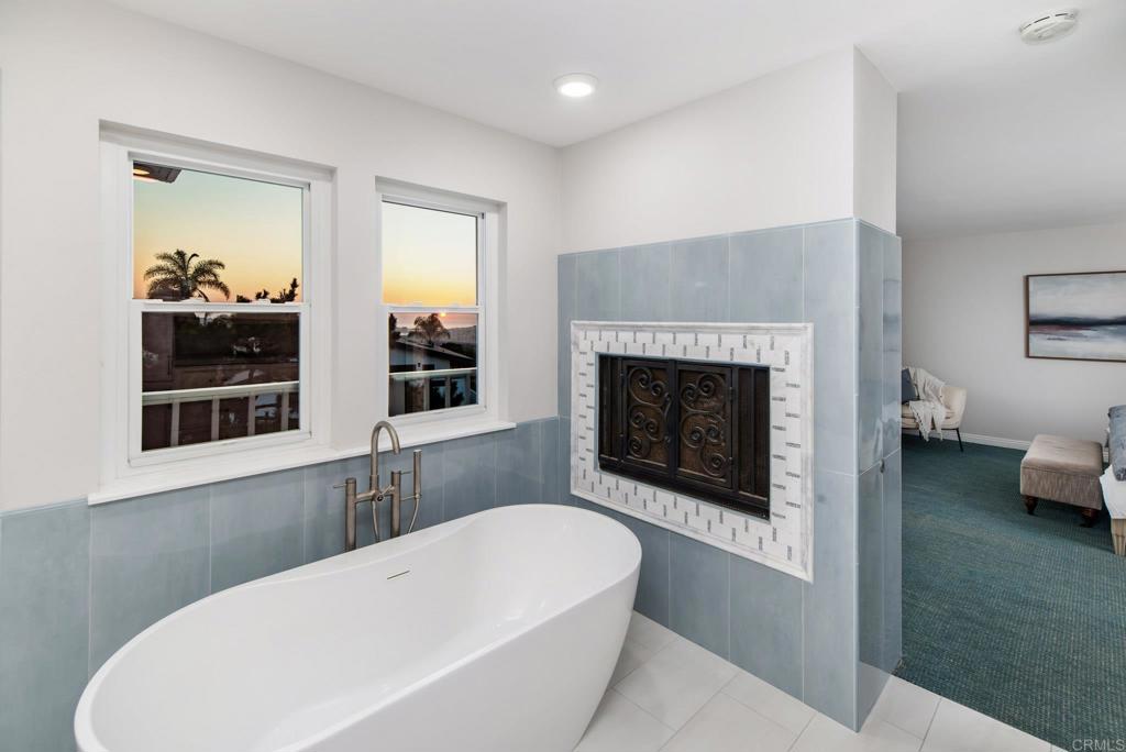 2515 Luciernaga Street Carlsbad, CA 92009 - Photo 31 of 58 a living room with furniture and a fireplace