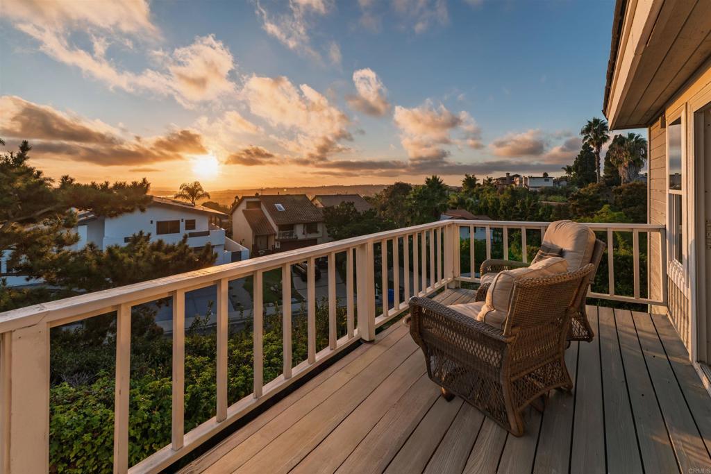 2515 Luciernaga Street Carlsbad, CA 92009 - Photo 32 of 58 a view of a balcony with wooden floor and outdoor seating