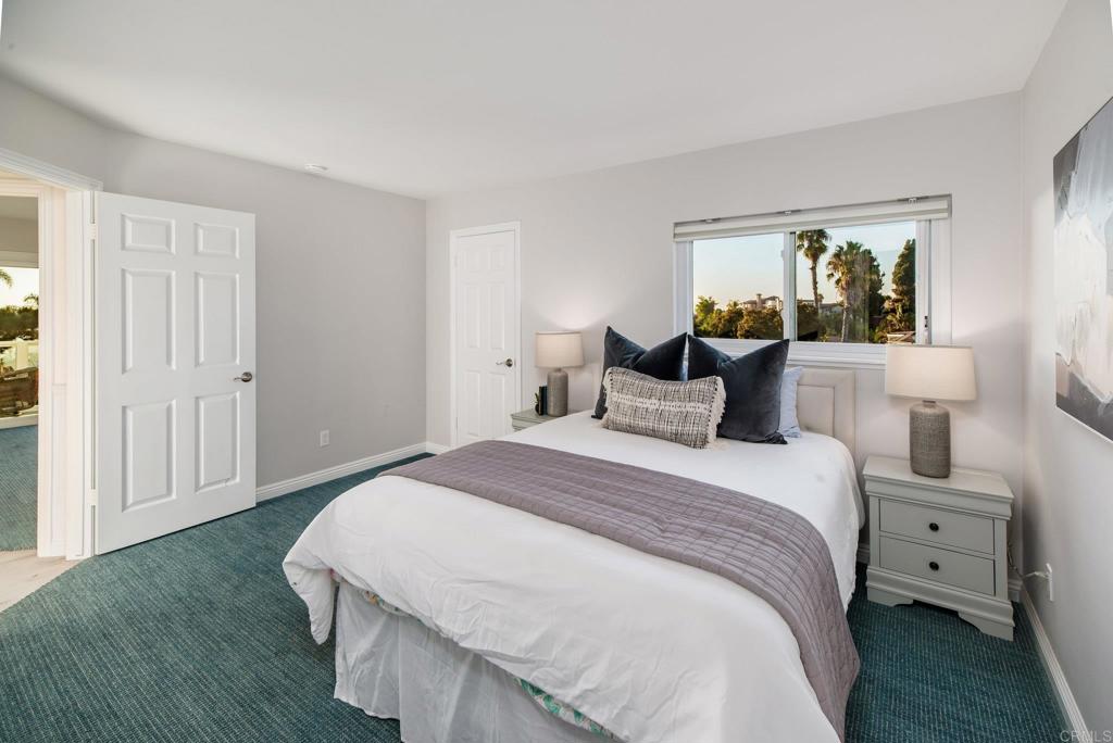 2515 Luciernaga Street Carlsbad, CA 92009 - Photo 38 of 58 a spacious bedroom with a bed and window