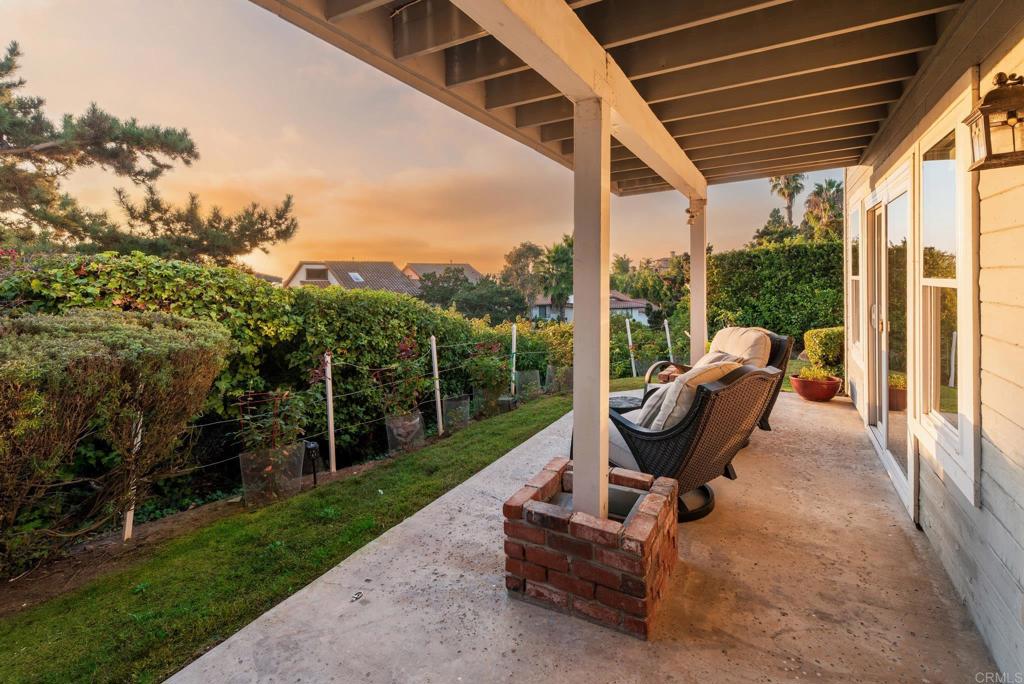 2515 Luciernaga Street Carlsbad, CA 92009 - Photo 40 of 58 a view of a patio with a table chairs and a backyard