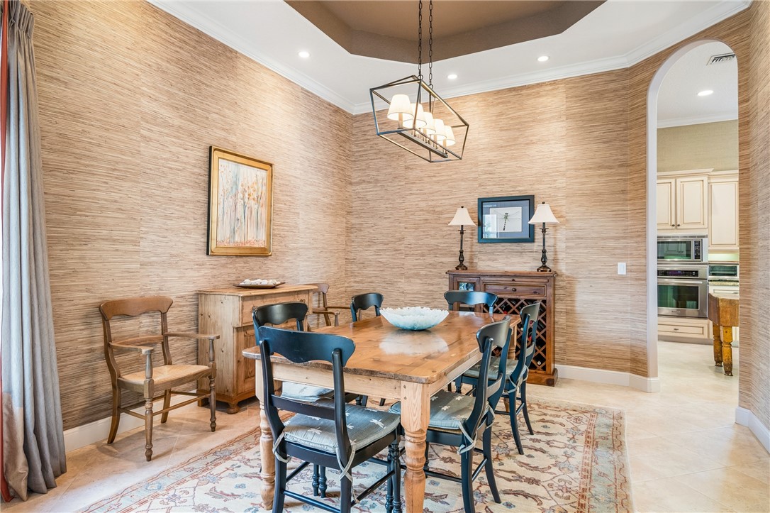 1286 Riverside Place Vero Beach, FL 32963 - Photo 12 of 36 a view of a dining room with furniture and chandelier