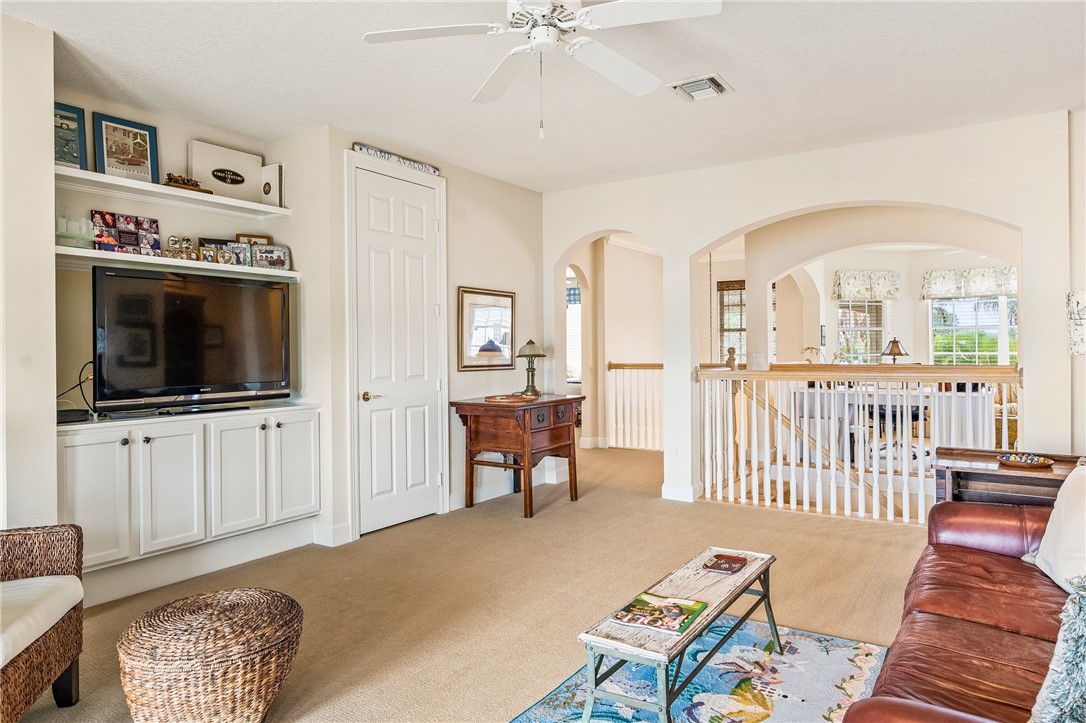 1286 Riverside Place Vero Beach, FL 32963 - Photo 23 of 36 a living room with furniture and a flat screen tv