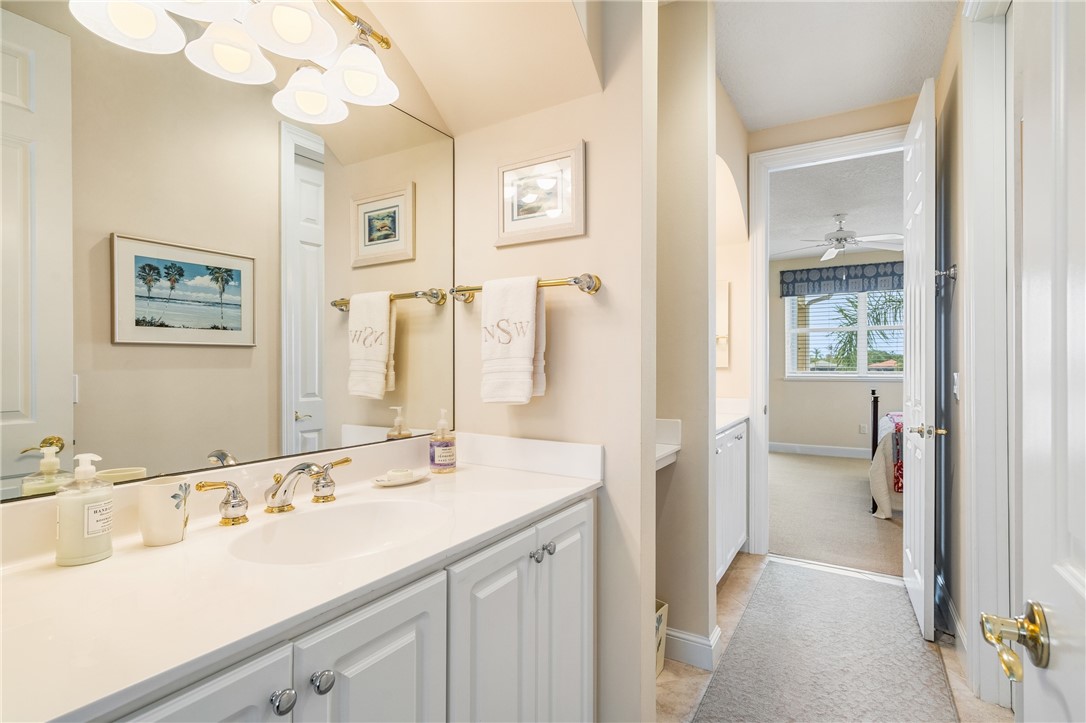 1286 Riverside Place Vero Beach, FL 32963 - Photo 26 of 36 a bathroom with a sink and a mirror