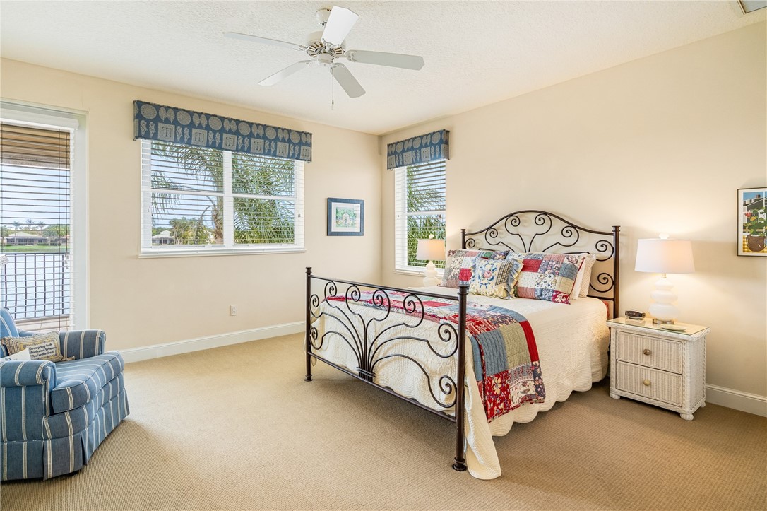1286 Riverside Place Vero Beach, FL 32963 - Photo 28 of 36 a bedroom with a bed and a couch