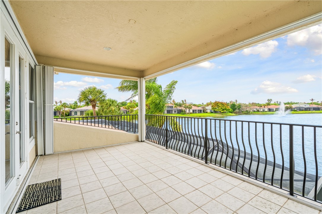 1286 Riverside Place Vero Beach, FL 32963 - Photo 29 of 36 a view of a room with wooden floor and windows
