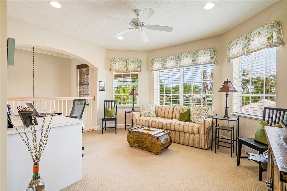 1286 Riverside Place Vero Beach, FL 32963 - Photo 30 of 36 a living room with furniture and a large window