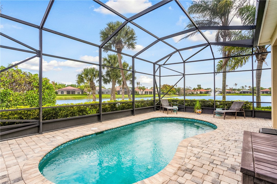 1286 Riverside Place Vero Beach, FL 32963 - Photo 7 of 36 a view of a swimming pool with a porch
