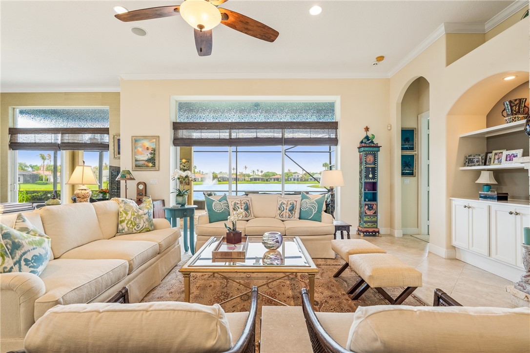 1286 Riverside Place Vero Beach, FL 32963 - Photo 9 of 36 a living room with furniture and a large window