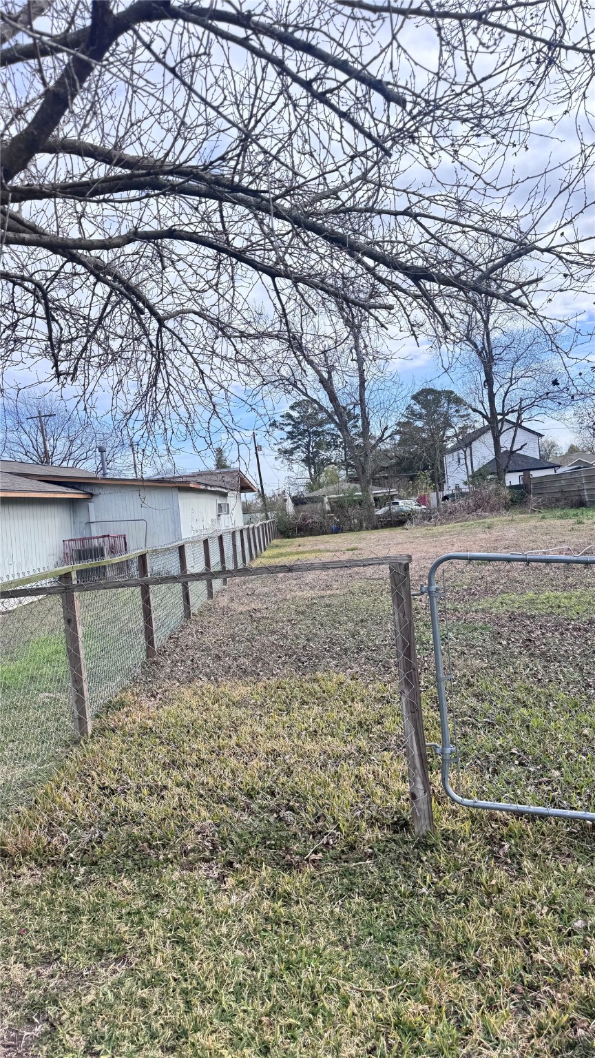 6414 Haight Street Houston, TX 77028 - Photo 3 of 7 a view of a yard with wooden fence