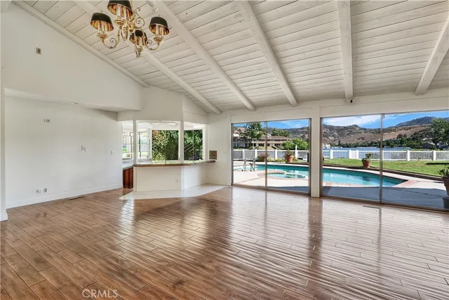 a view of a kitchen with a large window