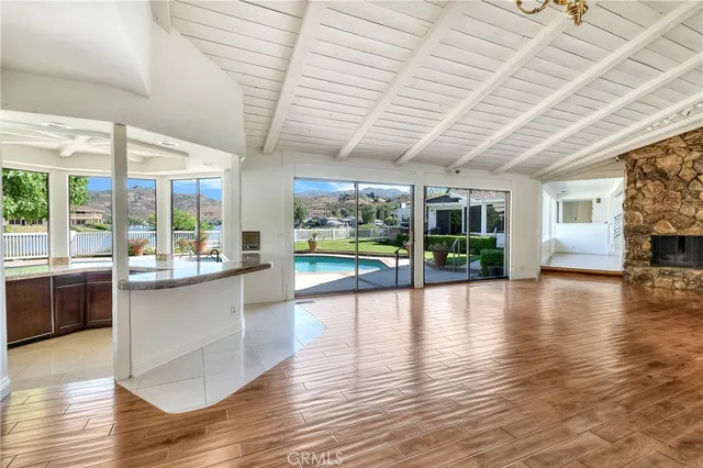 a kitchen with granite countertop a oven and a large window