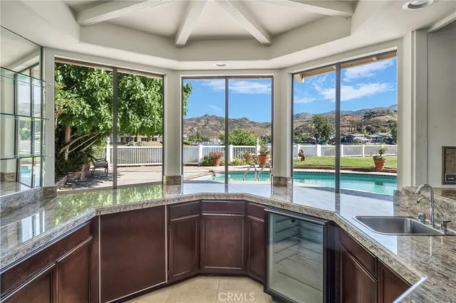 a kitchen with stainless steel appliances granite countertop a sink and cabinets