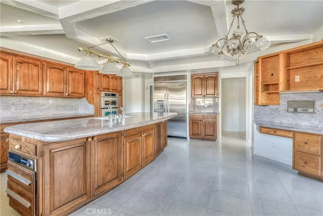 a living room with granite countertop furniture and fireplace