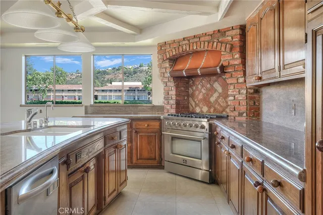 a bathroom with a granite countertop sink and mirror