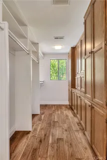 a view of a lake with houses in the back