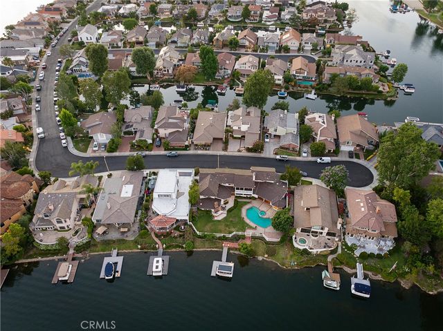 an aerial view of a house with swimming pool patio and outdoor seating