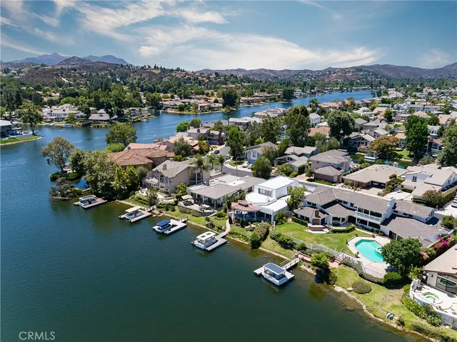 a view of a house with swimming pool and porch