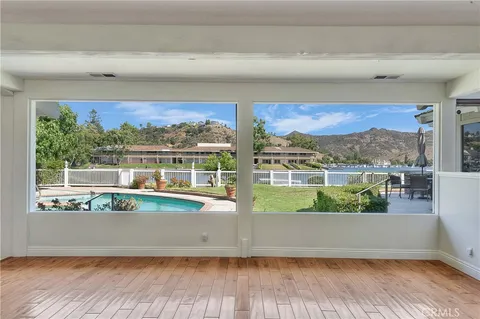 a view of a living room and a floor to ceiling window