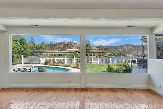 a view of a living room and a floor to ceiling window