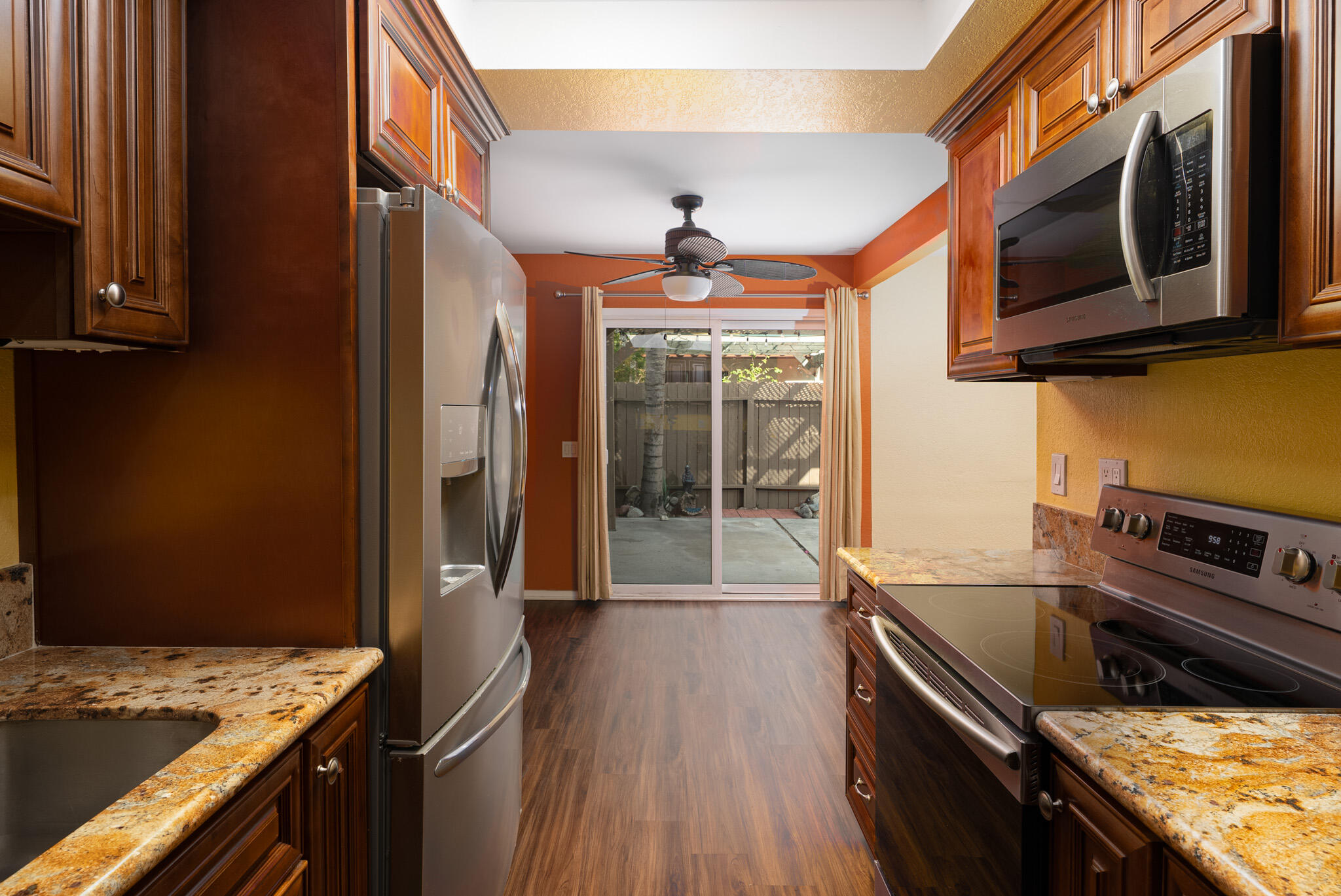 343 West Mariscal Road Palm Springs, CA 92262 - Photo 4 of 32 a kitchen with stainless steel appliances granite countertop a stove and a microwave