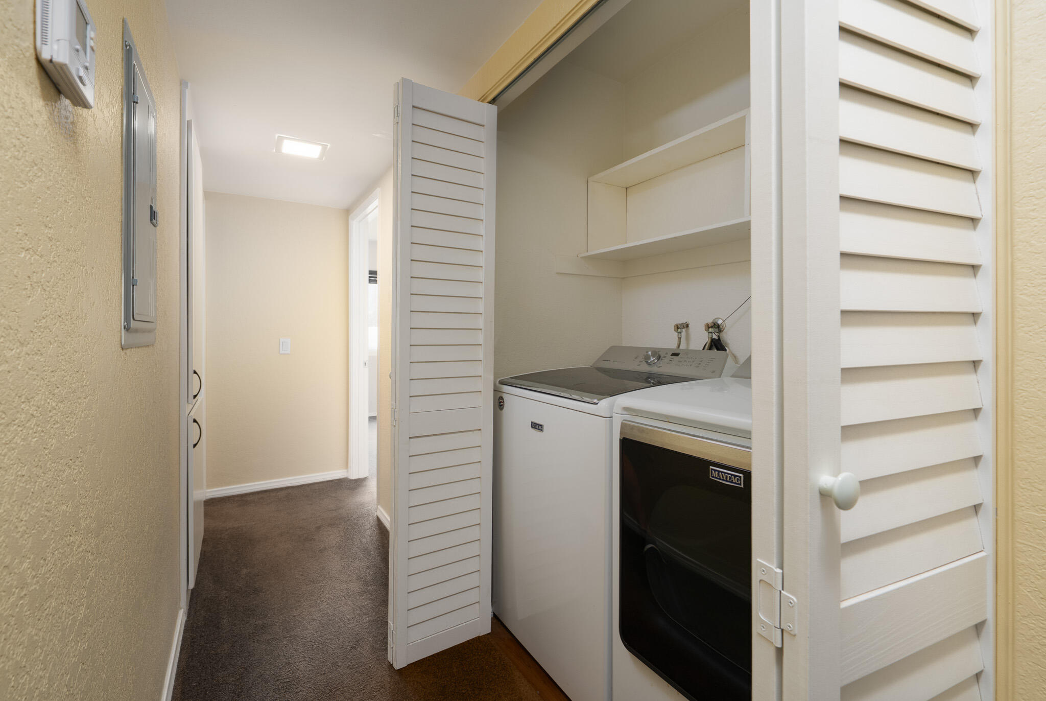 343 West Mariscal Road Palm Springs, CA 92262 - Photo 7 of 32 a view of hallway with washer and dryer