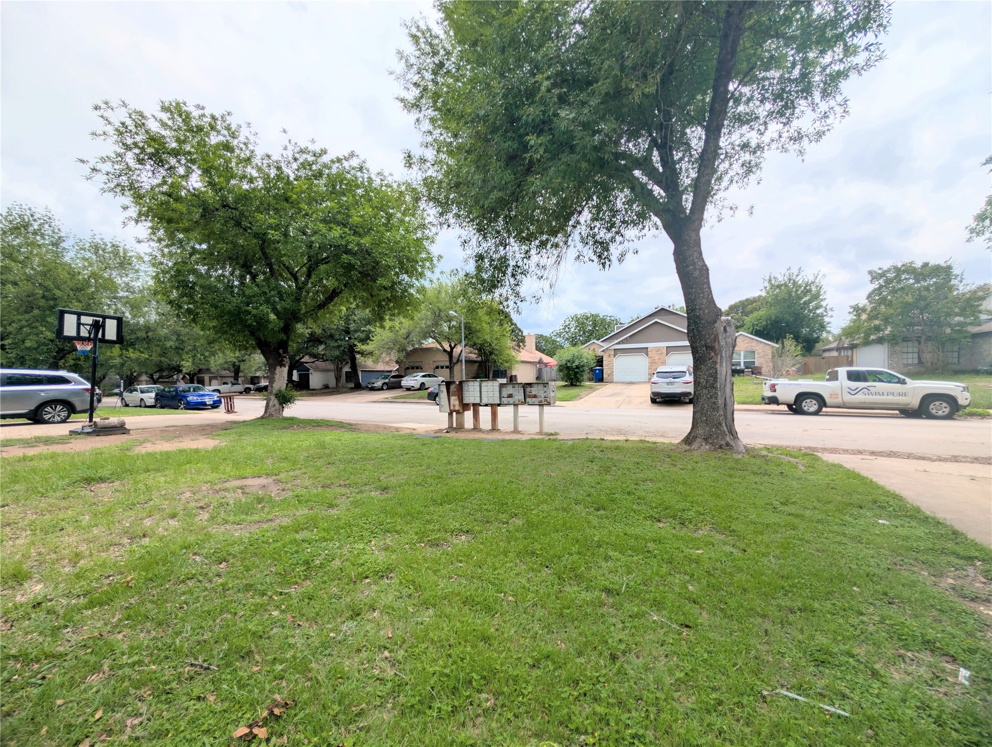 2018 Redwing Way Round Rock, TX 78664 - Photo 4 of 27 Front yard grass lawn with mature trees and paved street access