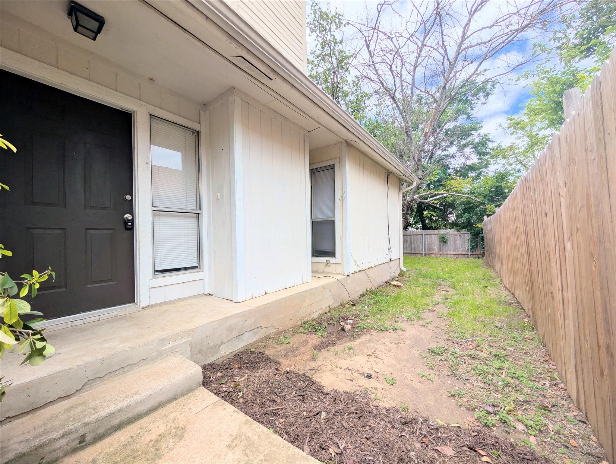 2018 Redwing Way Round Rock, TX 78664 - Photo 6 of 27 Front entry featuring a dark paneled door and adjacent vertical window