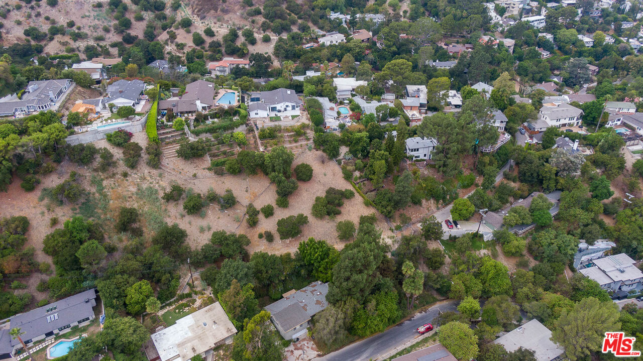 3923 Deer Avenue Sherman Oaks, CA 91423 - Photo 12 of 16 an aerial view of residential houses with outdoor space and trees