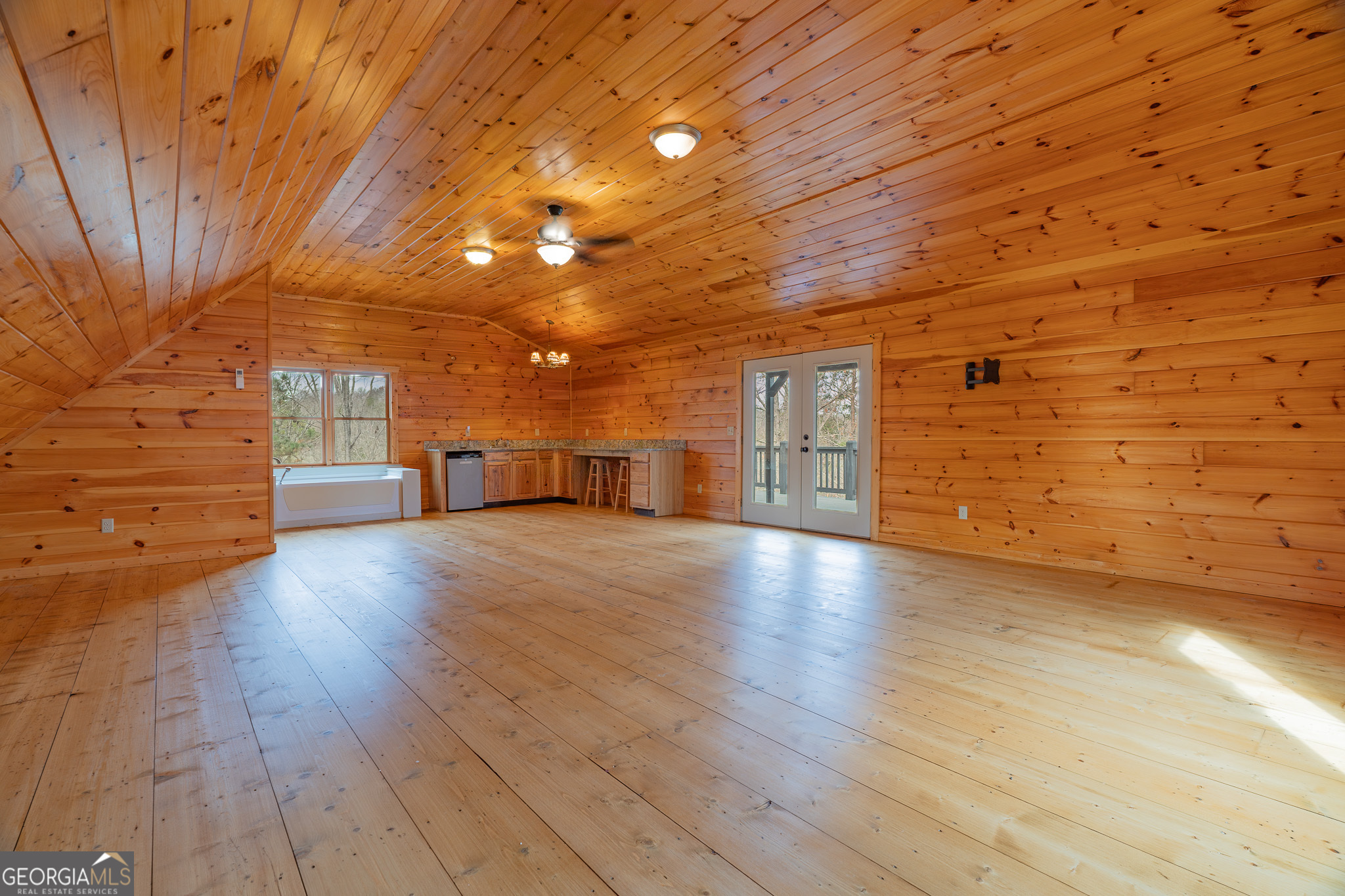 148 Gradient Court Ellijay, GA 30540 - Photo 14 of 28 a view of empty room with wooden floor and windows
