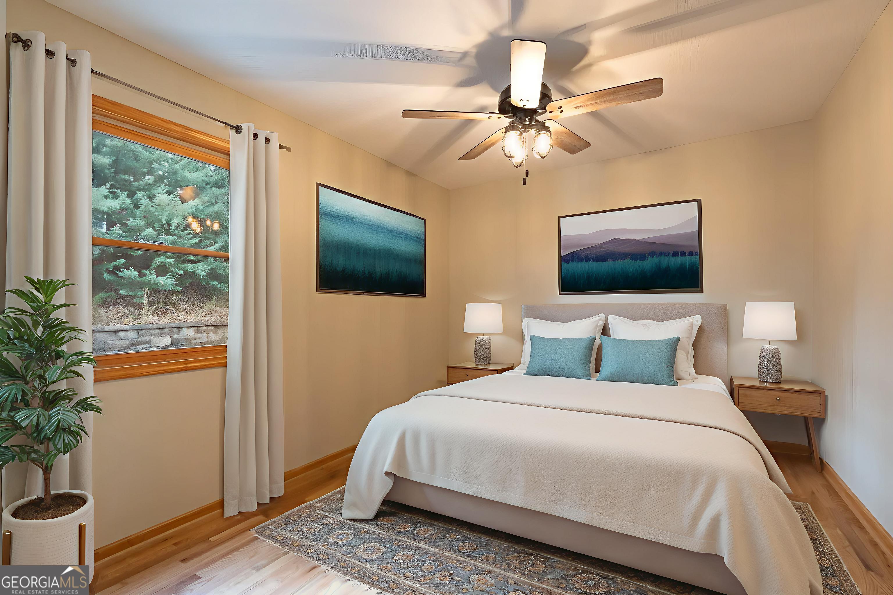 148 Gradient Court Ellijay, GA 30540 - Photo 23 of 28 a bedroom with a bed and a chandelier