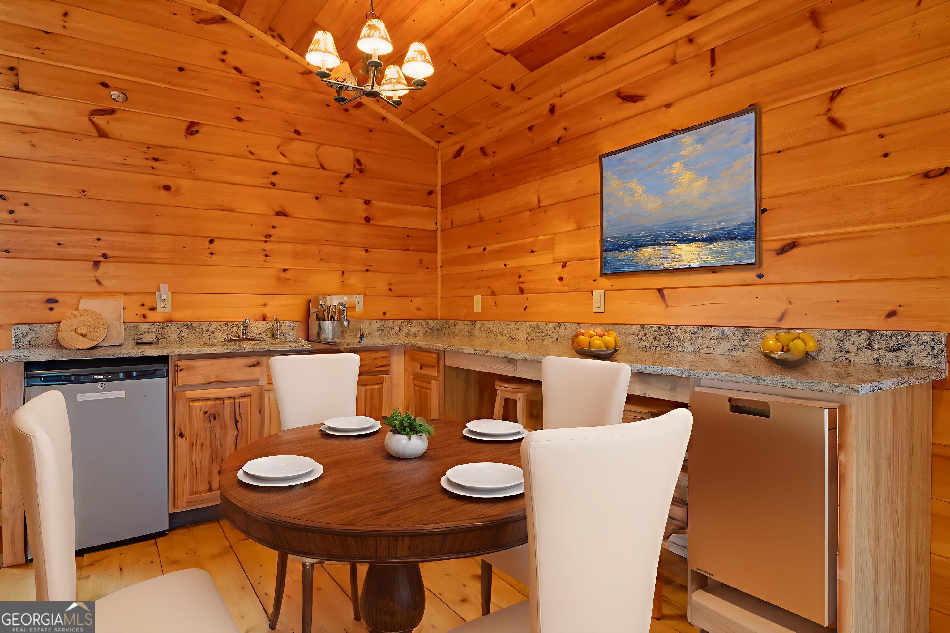 148 Gradient Court Ellijay, GA 30540 - Photo 25 of 28 a view of a dining room with furniture and wooden floor