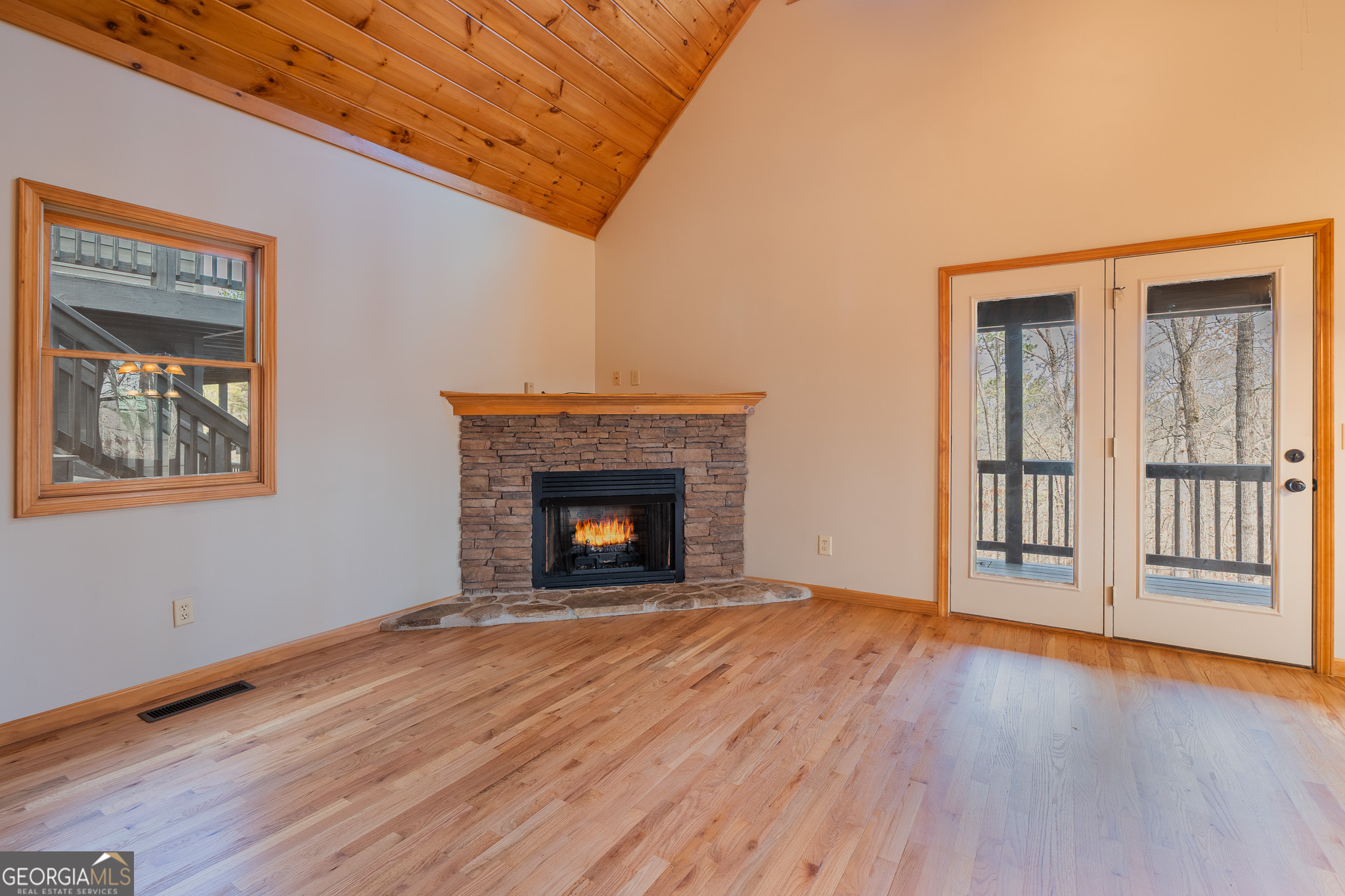 148 Gradient Court Ellijay, GA 30540 - Photo 6 of 28 a view of an empty room with wooden floor and a window