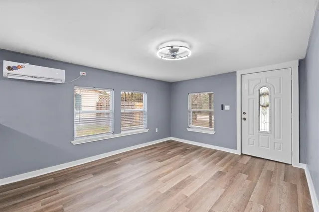 a view of an empty room with a window