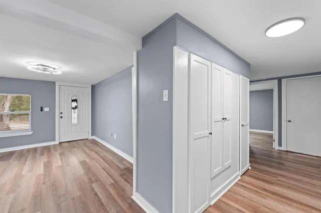 a view of entryway with wooden floor