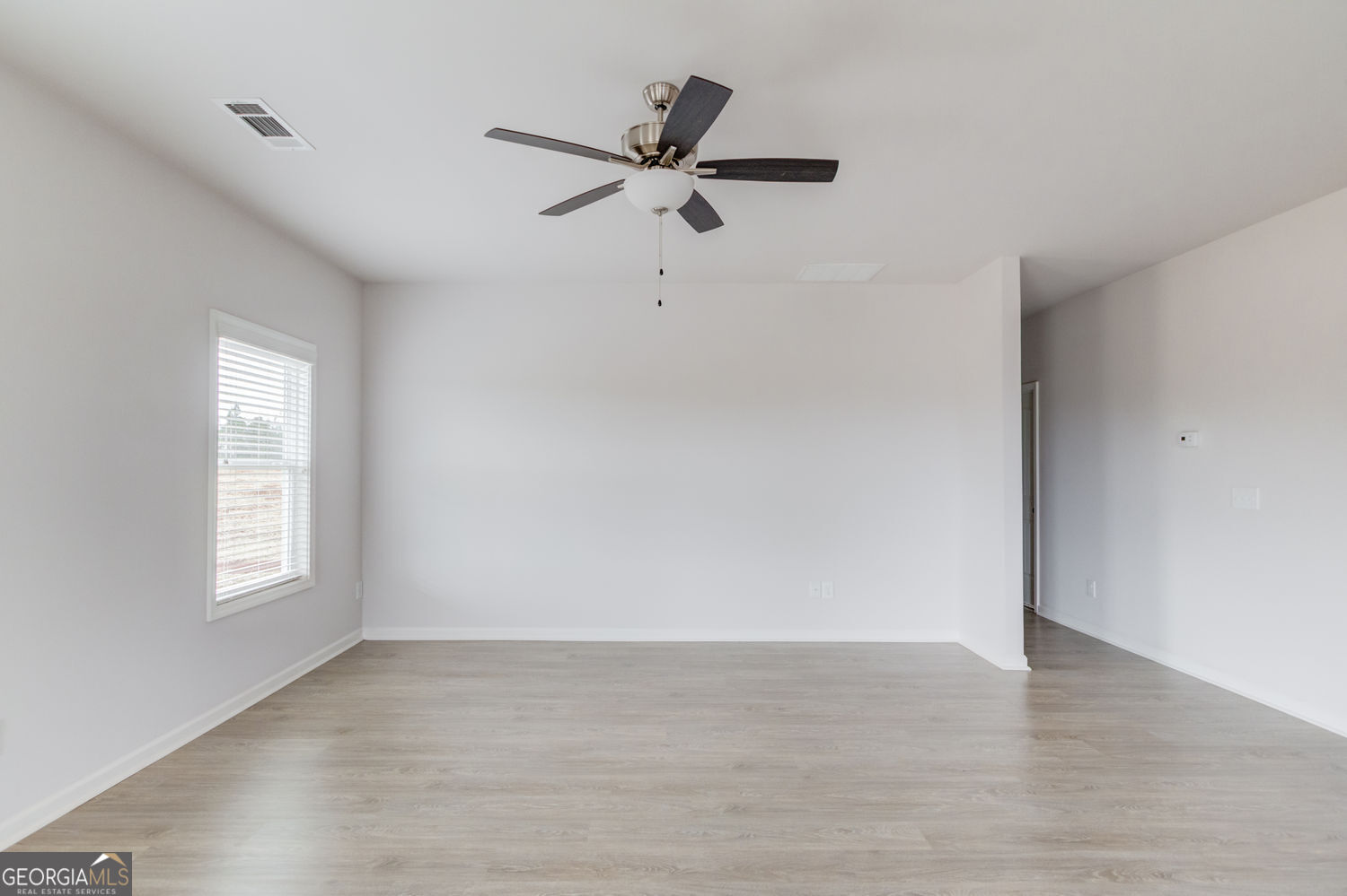 255 Cool Springs Road, Unit ROAD 7 Clarkesville, GA 30523 - Photo 11 of 42 wooden floor in an empty room with a window