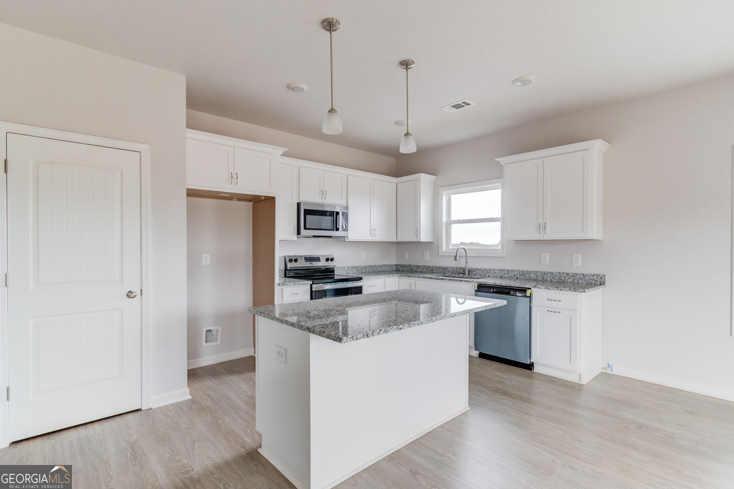 255 Cool Springs Road, Unit ROAD 7 Clarkesville, GA 30523 - Photo 13 of 42 a kitchen with stainless steel appliances granite countertop a sink a stove a refrigerator and white cabinets
