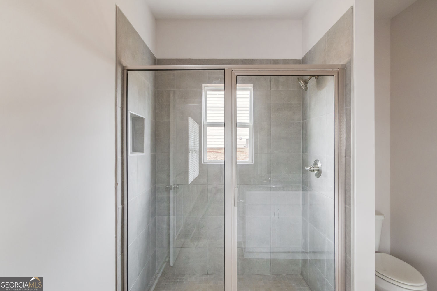 255 Cool Springs Road, Unit ROAD 7 Clarkesville, GA 30523 - Photo 25 of 42 a bathroom with a glass shower door