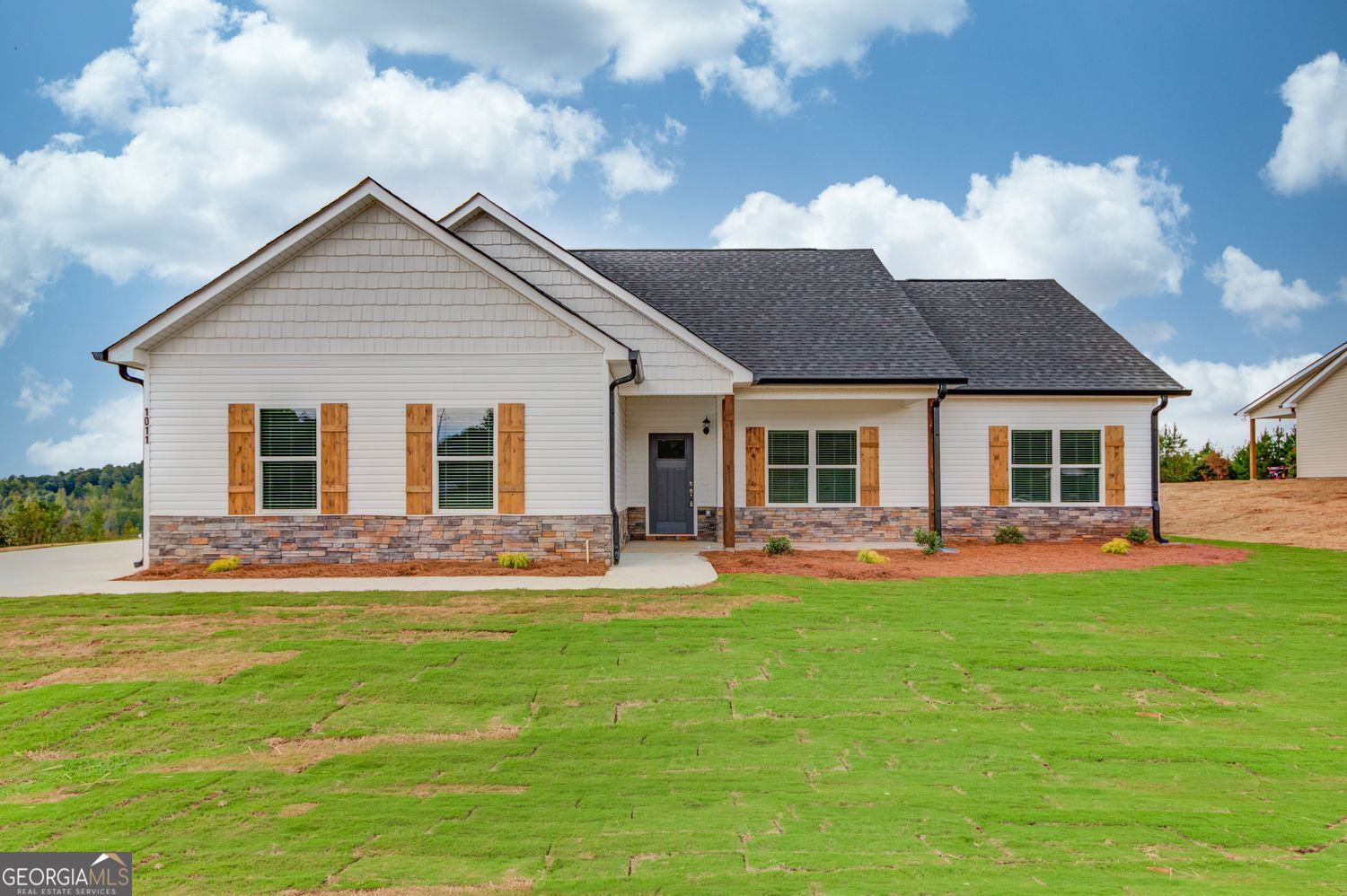 255 Cool Springs Road, Unit ROAD 7 Clarkesville, GA 30523 - Photo 3 of 42 a front view of house with yard and outdoor seating