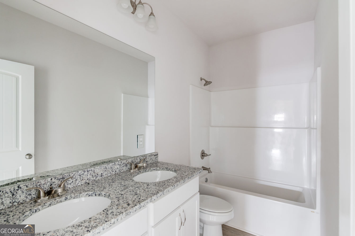 255 Cool Springs Road, Unit ROAD 7 Clarkesville, GA 30523 - Photo 31 of 42 a bathroom with a granite countertop sink a toilet and shower