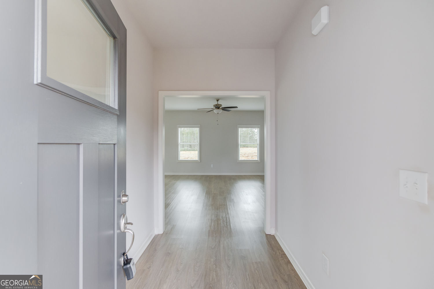 255 Cool Springs Road, Unit ROAD 7 Clarkesville, GA 30523 - Photo 5 of 42 a view of a hallway with wooden floor and closet