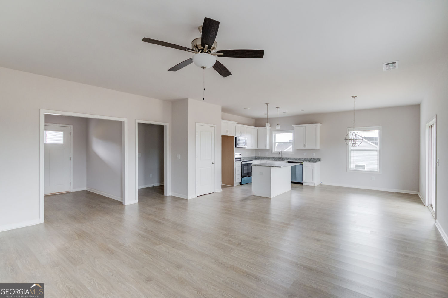255 Cool Springs Road, Unit ROAD 7 Clarkesville, GA 30523 - Photo 10 of 42 a view of empty room with wooden floor and window