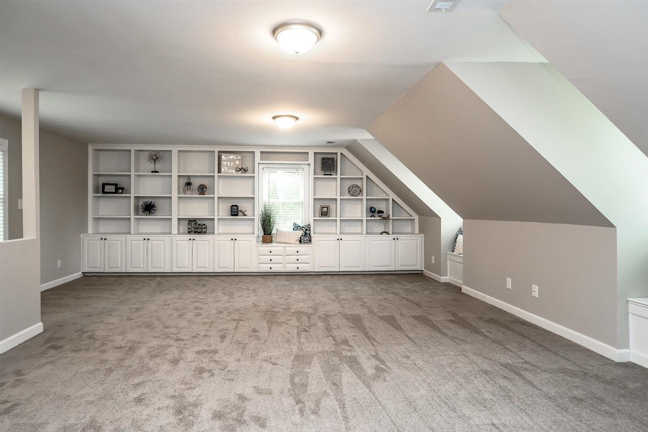 10709 Old Brook Court Raleigh, NC 27614 - Photo 10 of 11 HUGE bonus room off the Master Bedroom with gorgeous built ins, fresh paint and carpet. Back stairs off the bonus room ensure privacy. Bonus Room