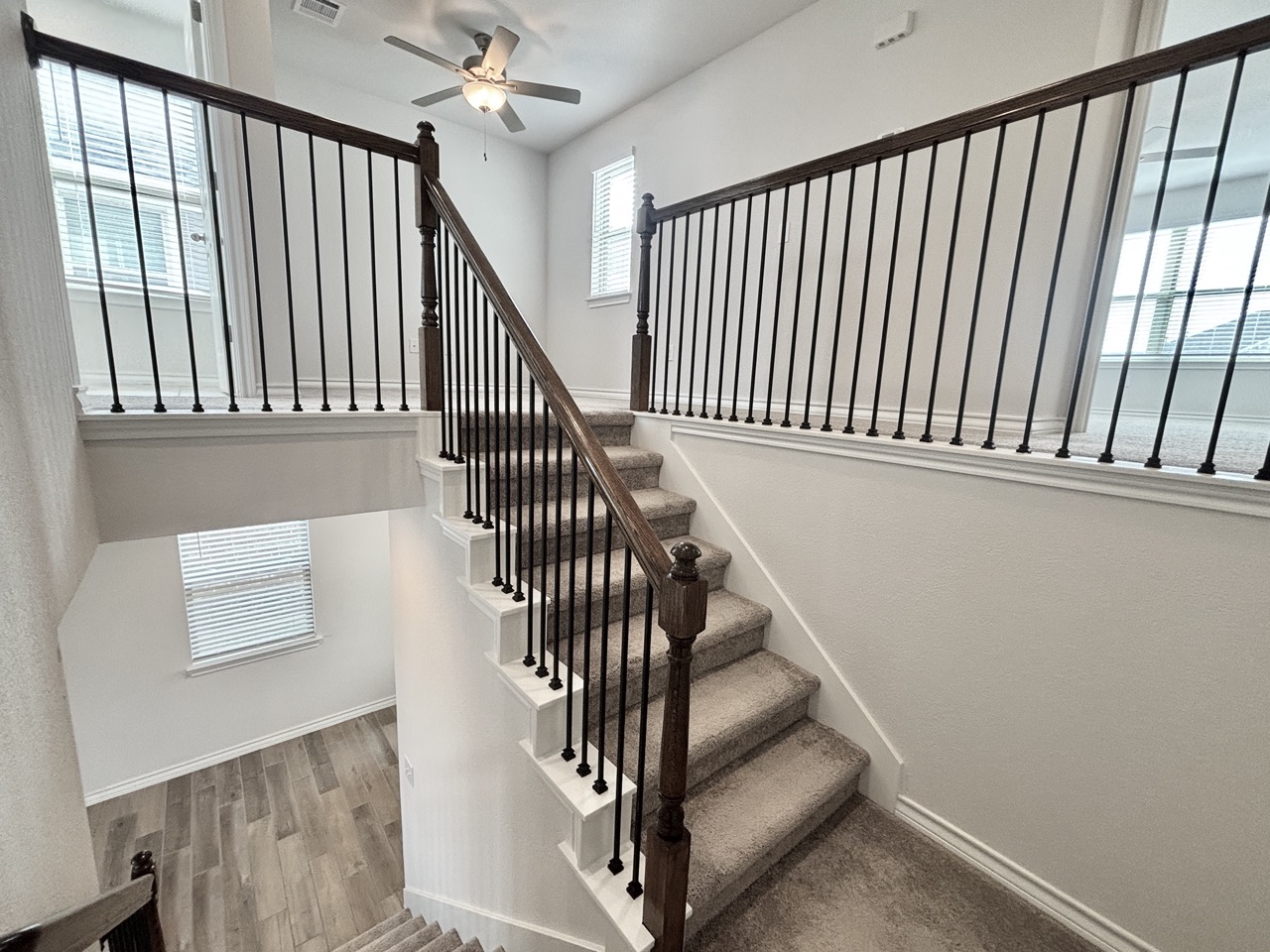 7606 Elk Grove Path Austin, TX 78754 - Photo 16 of 40 Stairs featuring wood finished floors and a ceiling fan